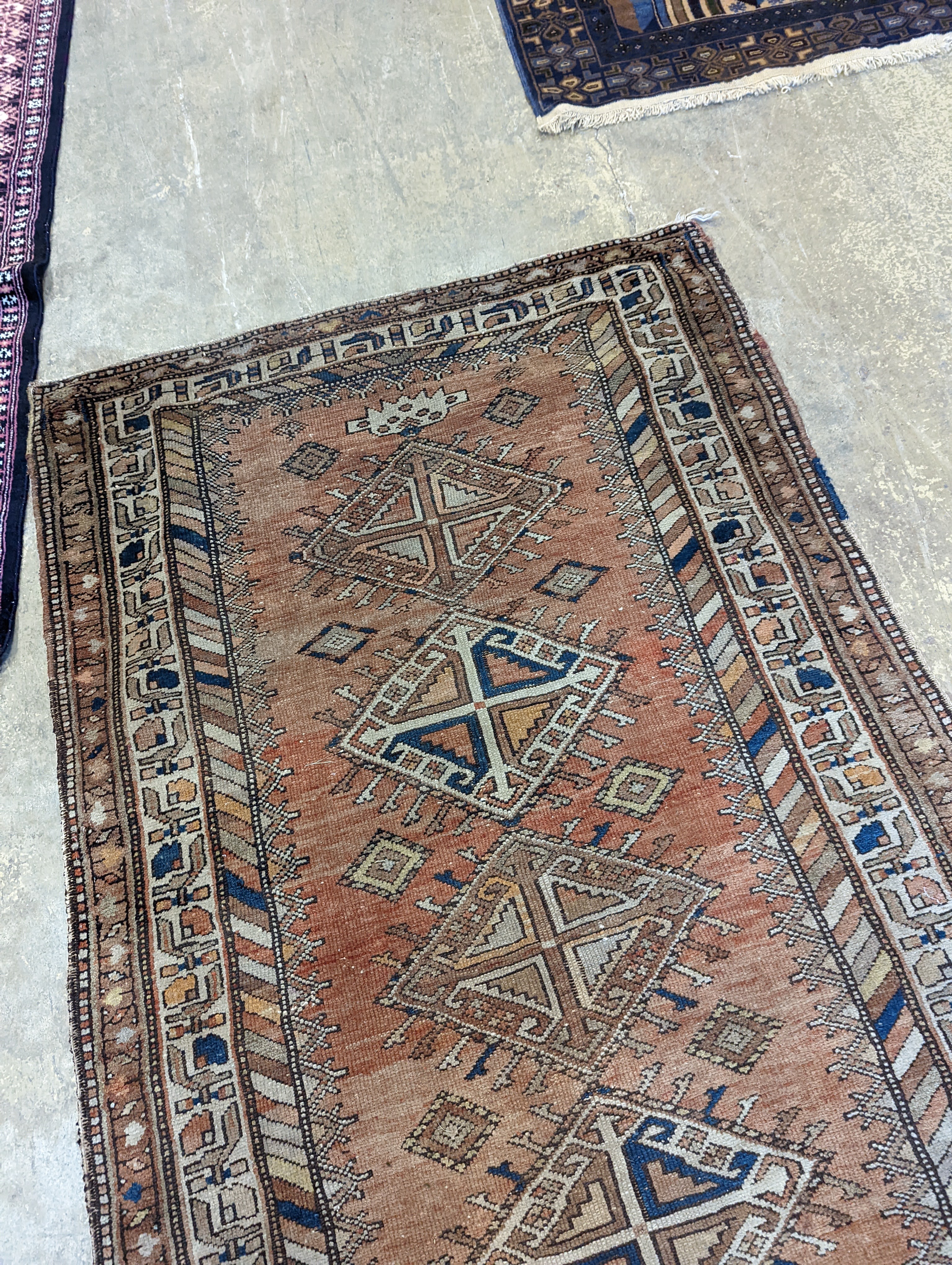 An antique Caucasian red ground runner, 372 x 106cm